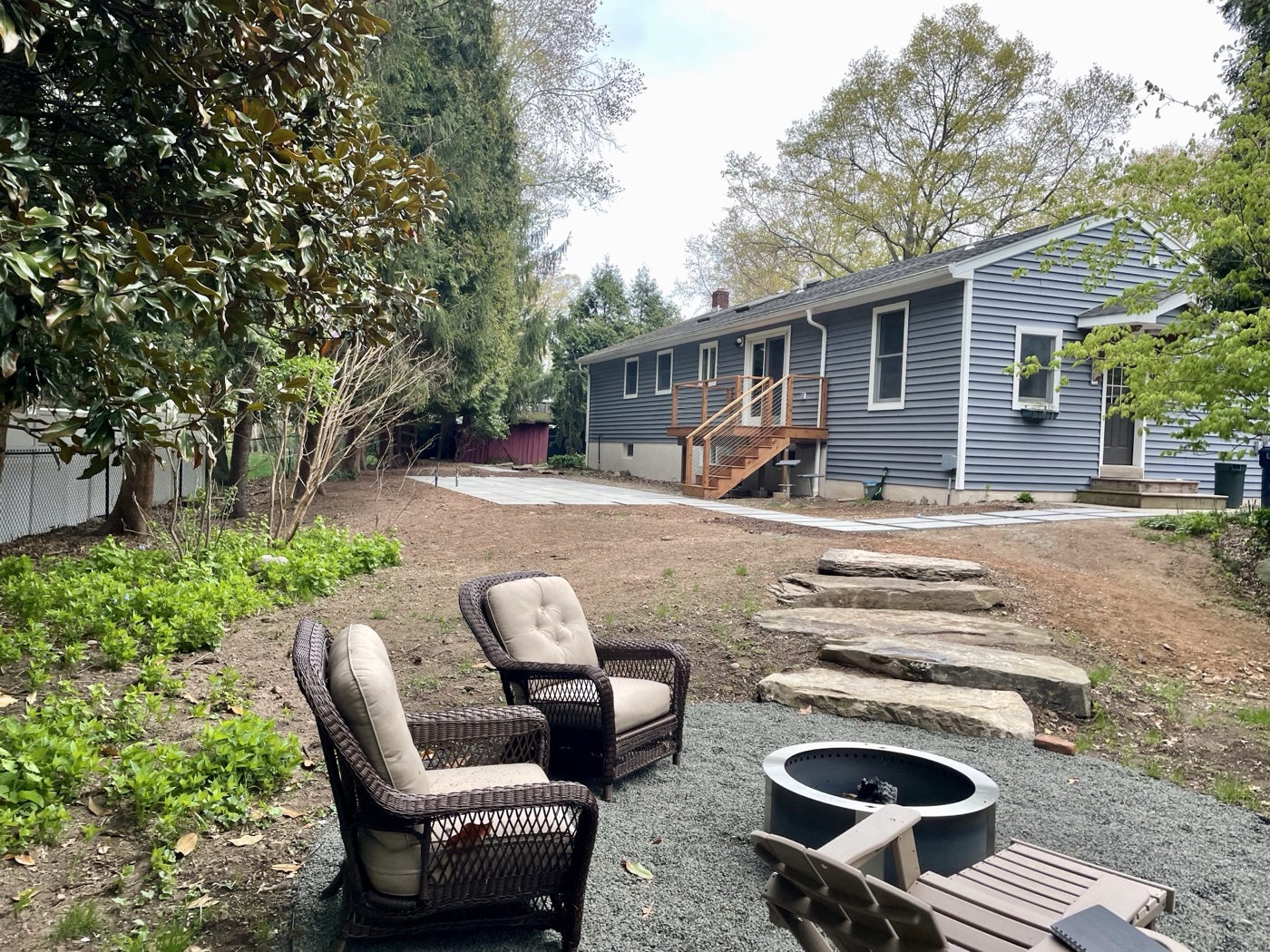 Before: bare backyard in early stages of hardscape installation